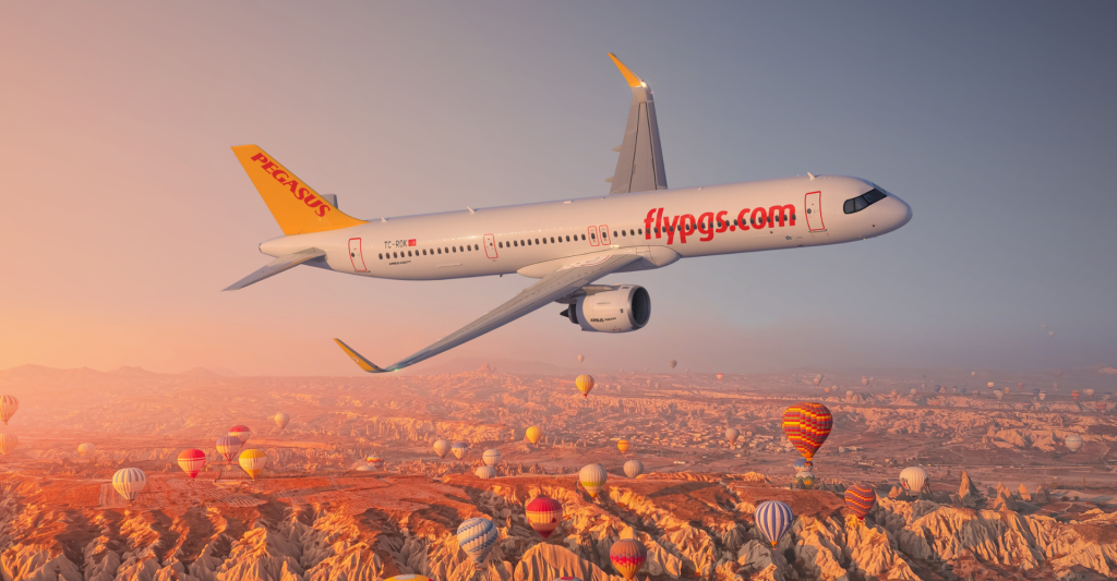 Airline CGI: Pegasus Airlines over the hot air balloons of Cappadocia during golden hour.